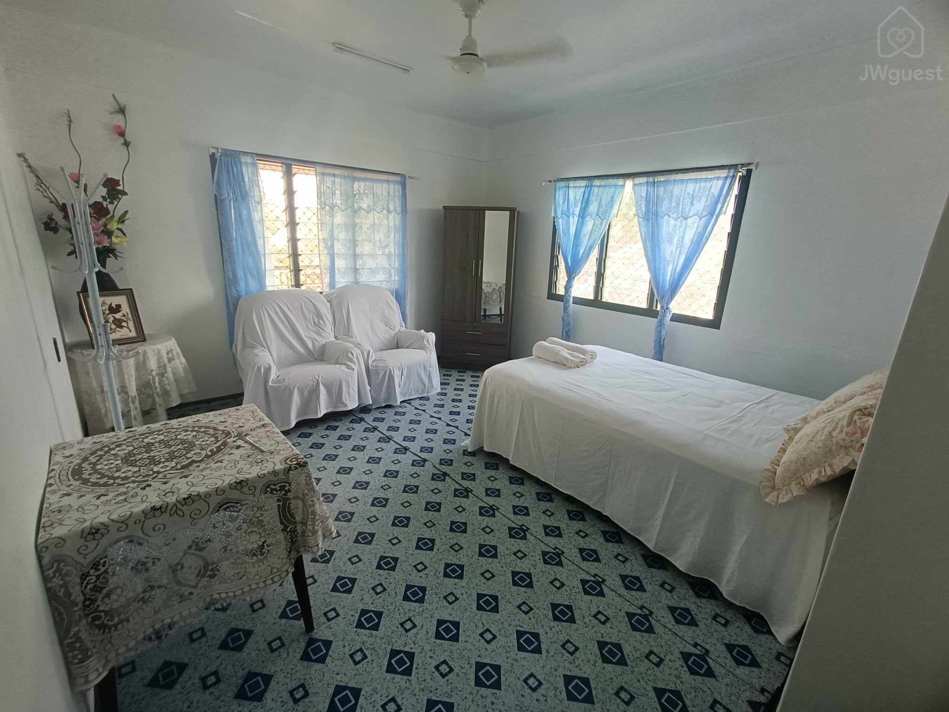 Large bedroom with queen bed and portable airconditioner, wardrobe and couches (single bed able to be added to room if… — Shared island home in beautiful Samoa - 2, Apia, Upolu