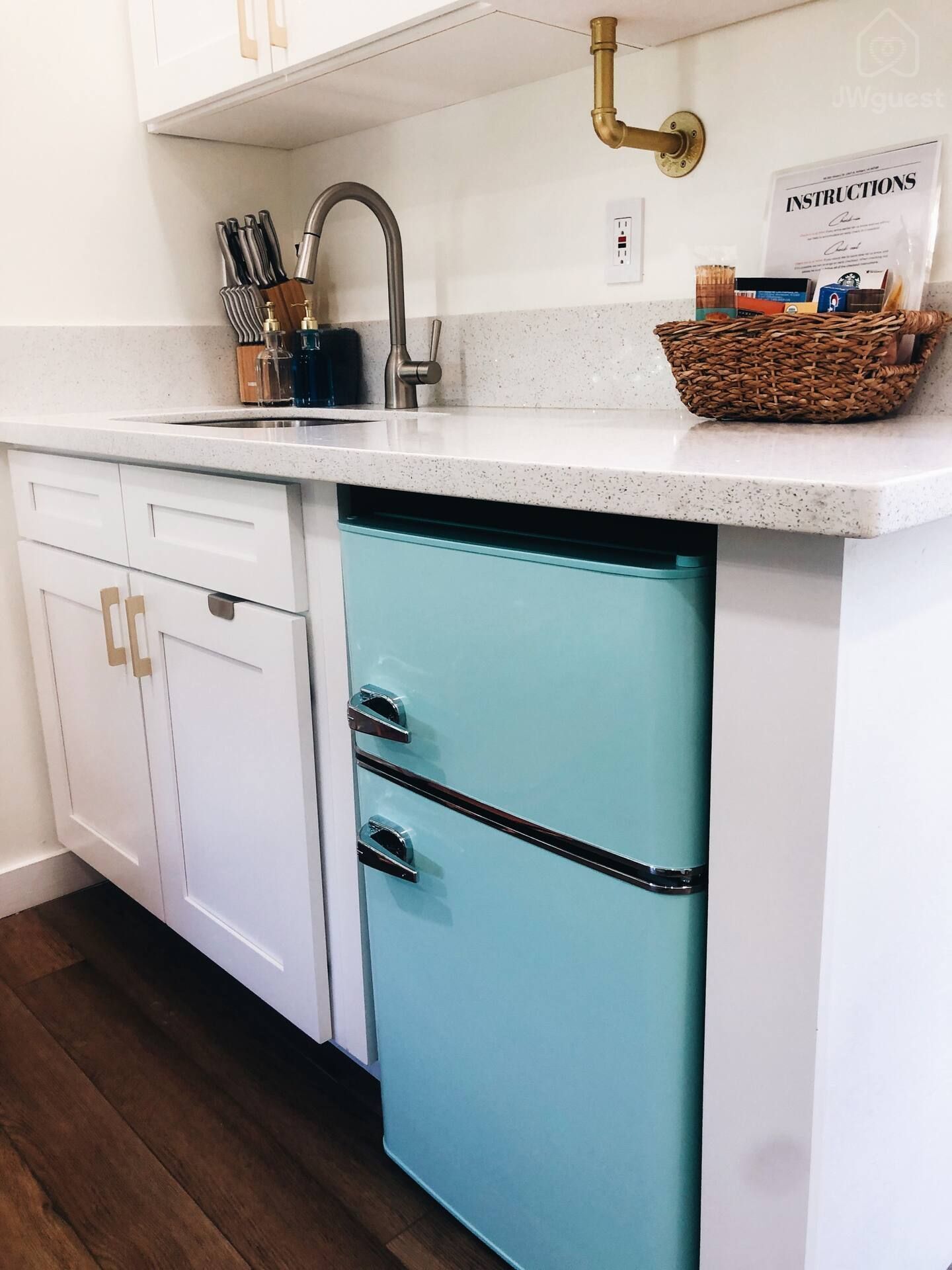 The compact kitchen has everything you need with a mini fridge/freezer, microwave, induction cook top, kettle, a French… — Elevated Jungle Treehouse with Loft BR, Mililani, Hawaii