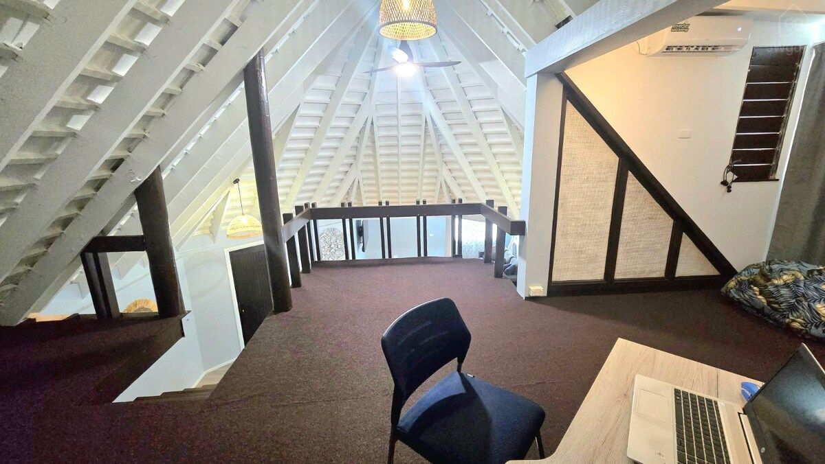 Desk and workspace in an open upstairs loft — Villa Tautai, Pacific Harbour, Central Division
