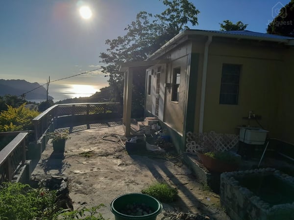 That is the morning sun coming up from the horizon! Fishpond was under construction.. — Sunrising Breeze at Grand Bay Dominica, Saint Patrick Parish