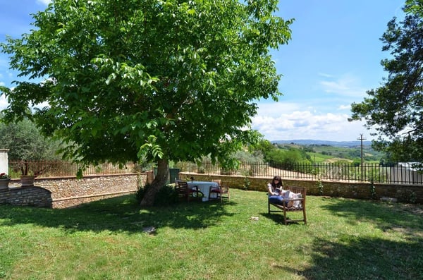 There's a garden with a stunning view of the vineyards. — The Barn under the Tuscan countryside, Tavarnelle, Toscana