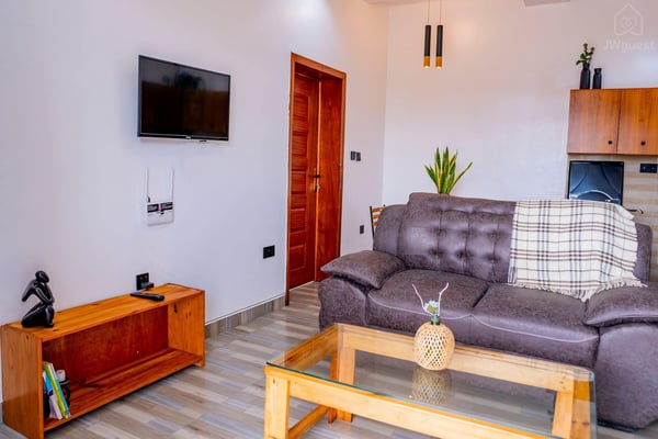 Living room — Cozy 2-Bedroom Haven Near KGL Airport - Valley View, Kigali, Kigali City