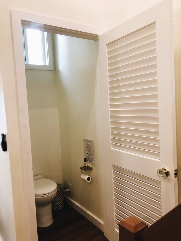 The bathroom is located at the foot of the stairs — Elevated Jungle Treehouse with Loft BR, Mililani, Hawaii