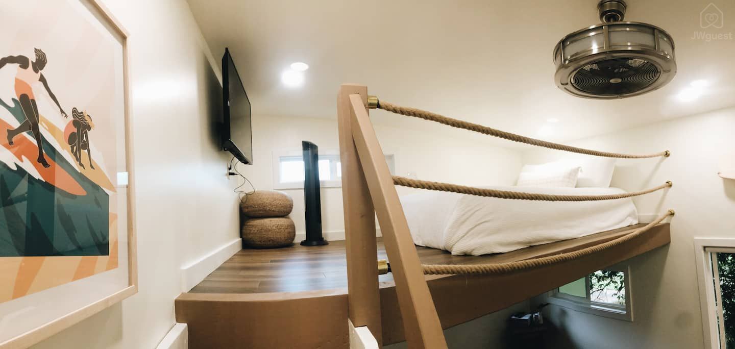 Hang out in the loft watching your favorite shows with two rattan floor seats — Elevated Jungle Treehouse with Loft BR, Mililani, Hawaii