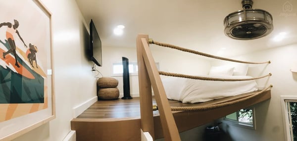 Hang out in the loft watching your favorite shows with two rattan floor seats — Elevated Jungle Treehouse with Loft BR, Mililani, Hawaii