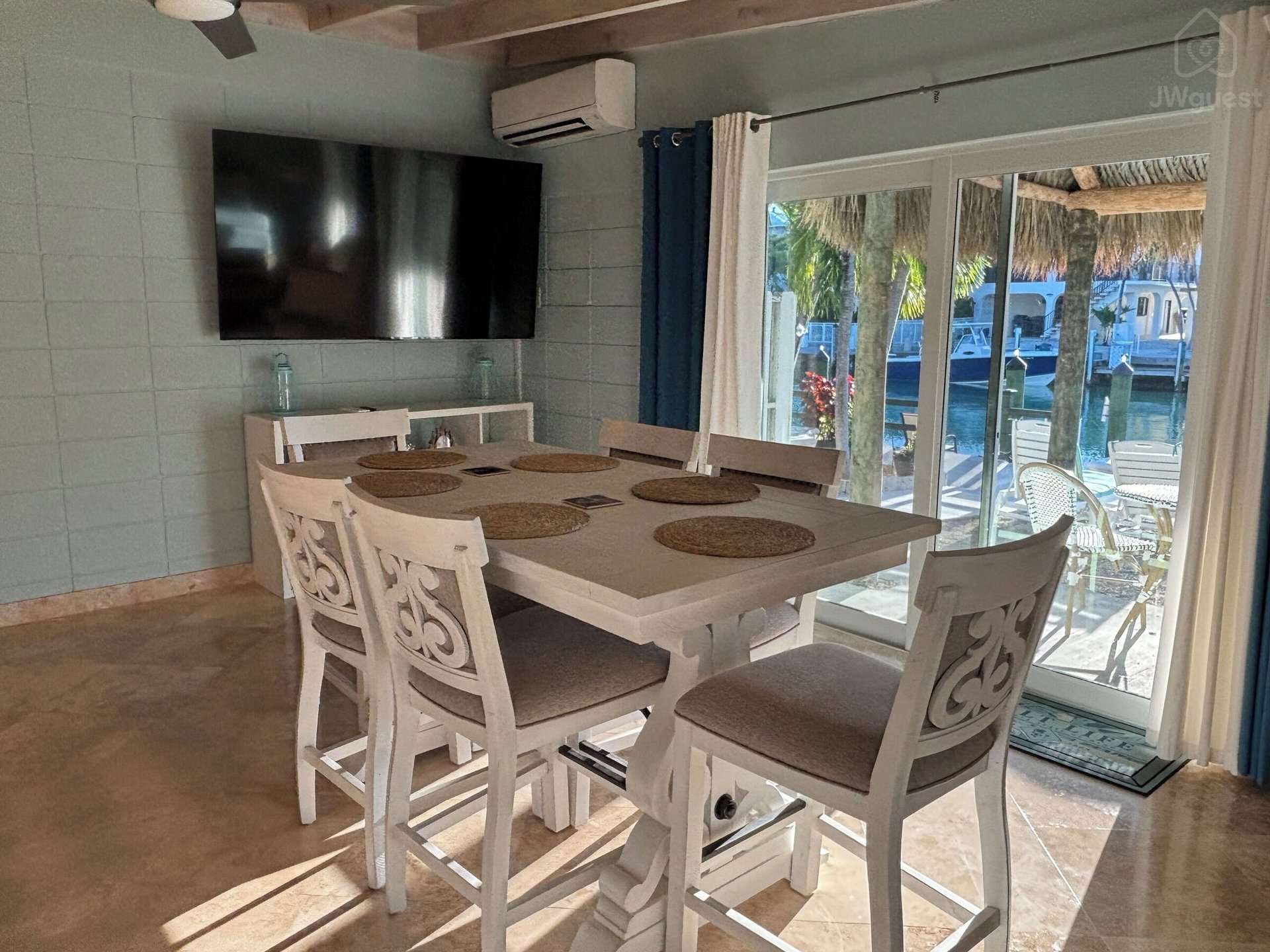 Dining table seats 8 with integrated leaf — Waterfront 3BR 3BA with 37 ft Dock Tiki Hut Access to Club Pool, Key Colony Beach, Florida