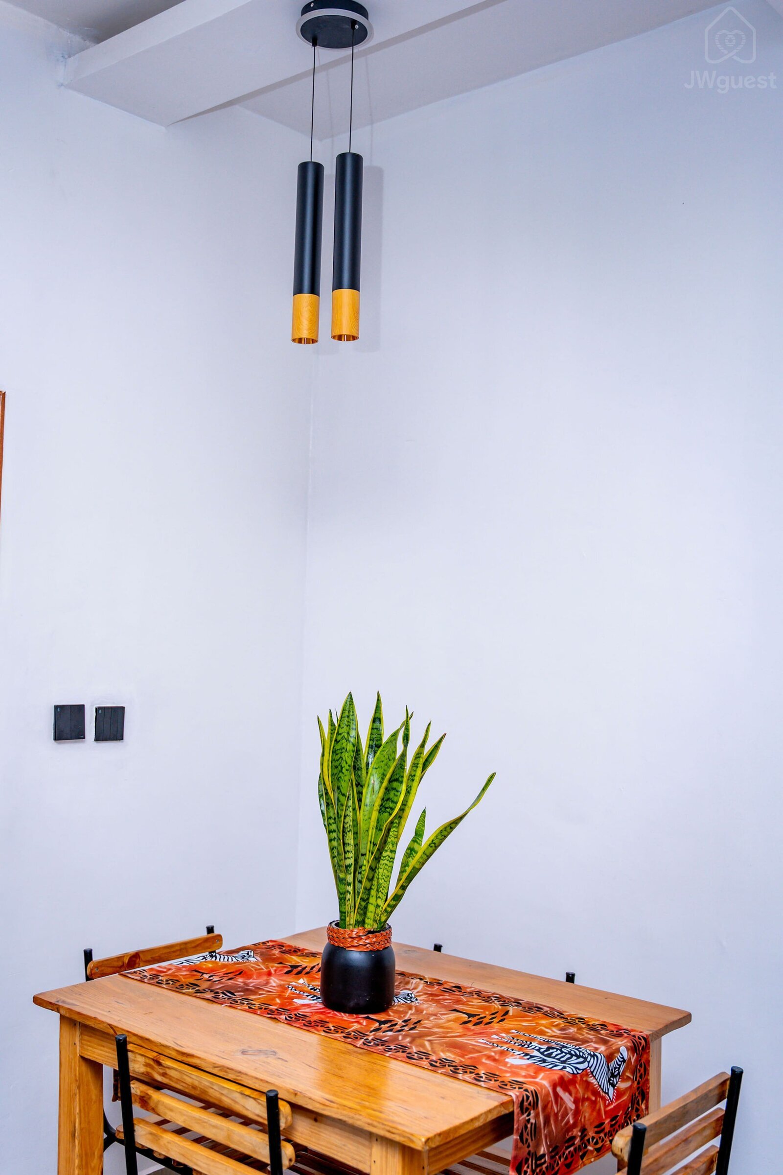 Sitting area - with four chairs and a comfortable table where you can both work and have your meals. — Cozy 2-Bedroom Haven Near KGL Airport - Valley View, Kigali, Kigali City