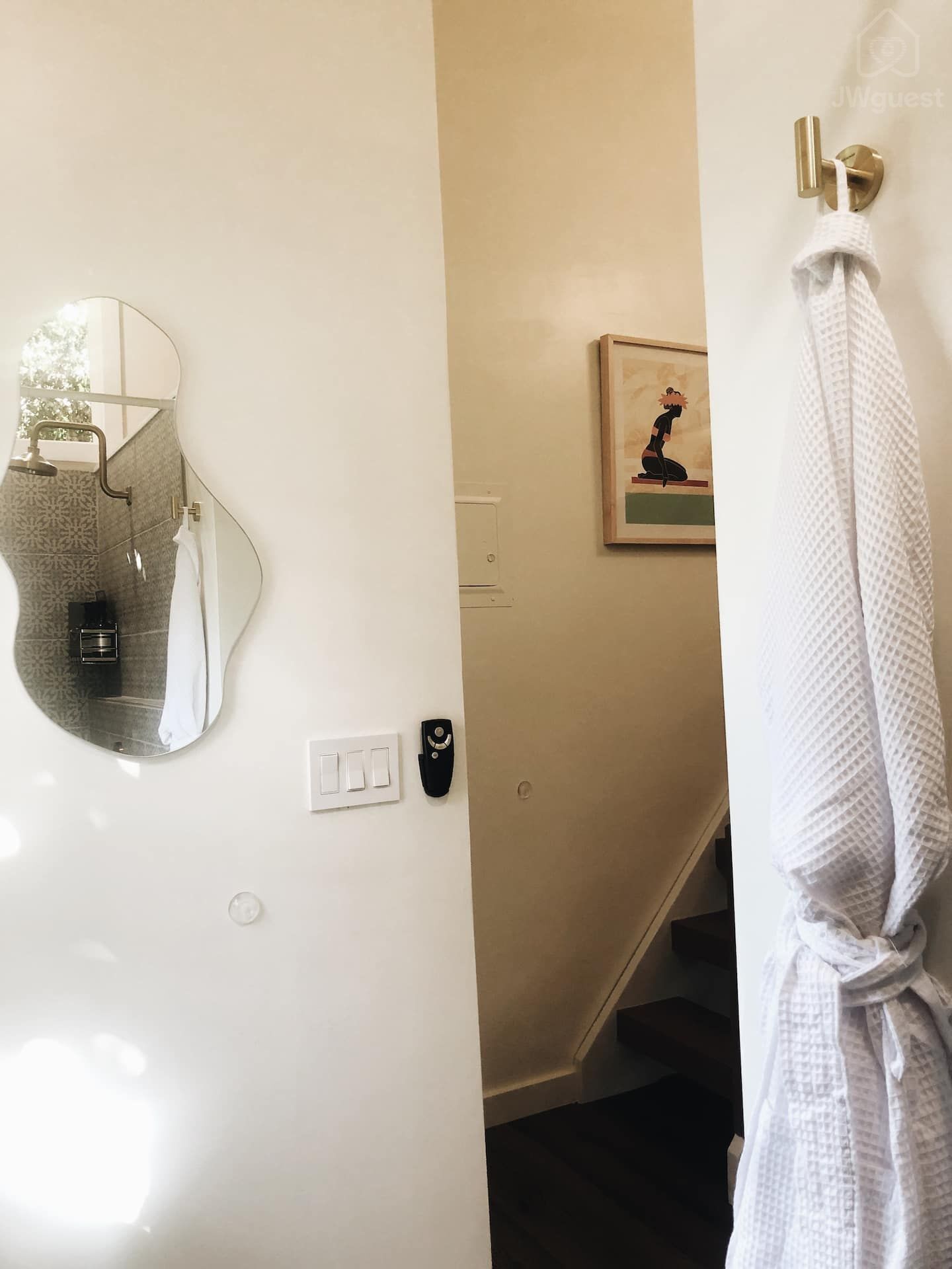 Throw on a guest robe and check yourself out in the asymmetrical mirror before heading out to lounge in the living area — Elevated Jungle Treehouse with Loft BR, Mililani, Hawaii