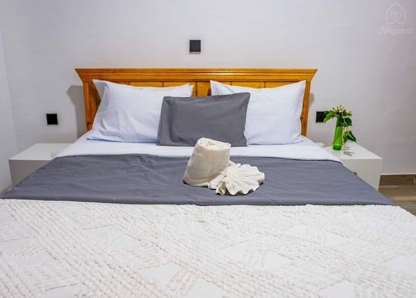Bedroom 2 - with a comfortable bed, newly furnished for your comfort and cozy sleep. There are also two bed side tables… — Cozy 2-Bedroom Haven Near KGL Airport - Valley View, Kigali, Kigali City
