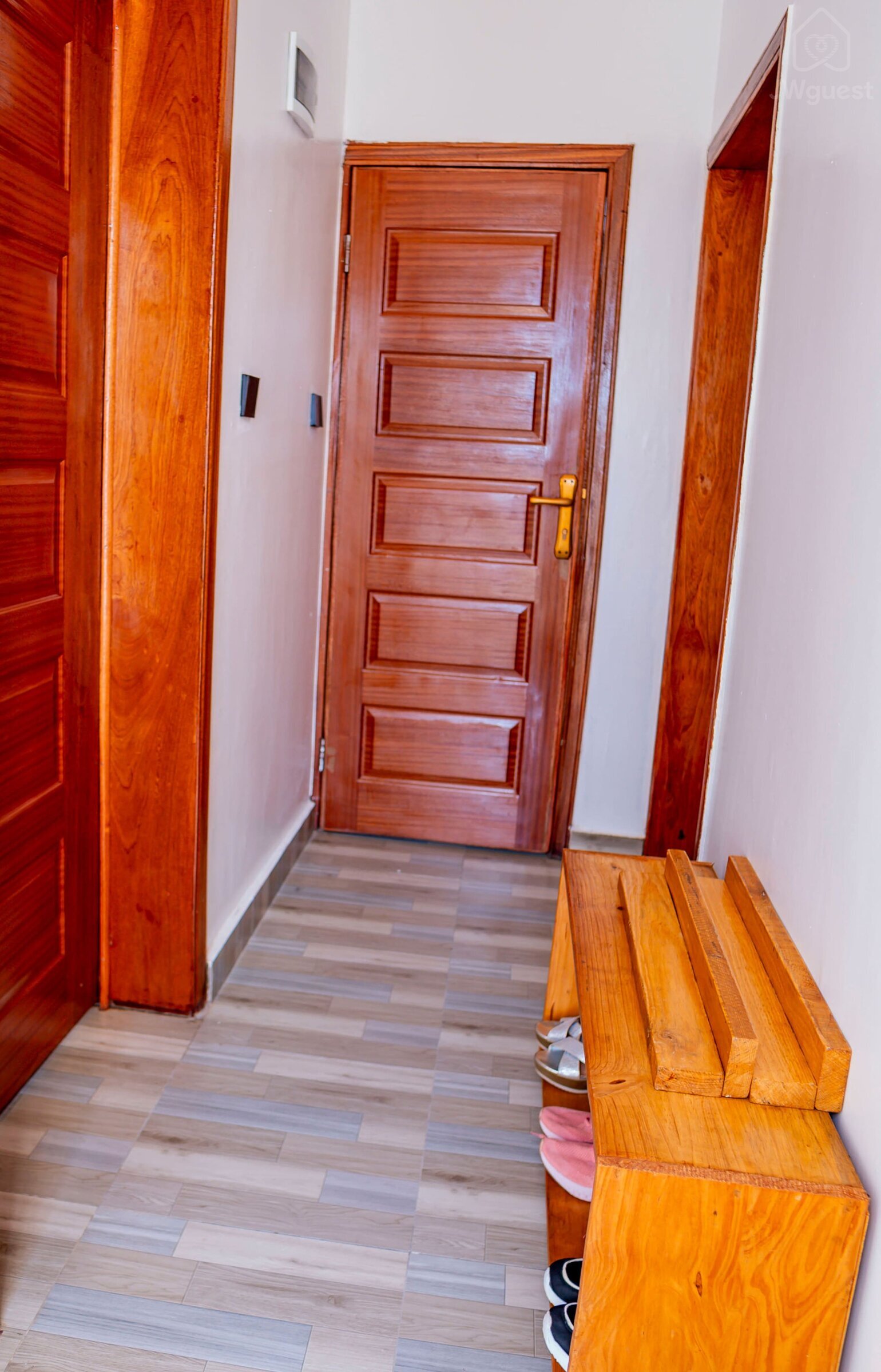 Corridor to the rooms and bathroom 2 - Ensuite bedroom 1 is located on the left - Bathroom 2 located straight ahead… — Cozy 2-Bedroom Haven Near KGL Airport - Valley View, Kigali, Kigali City
