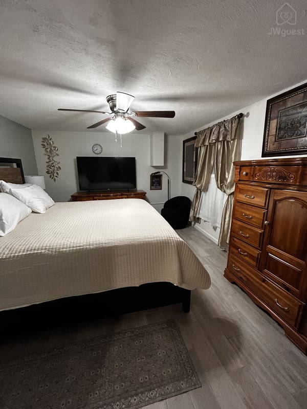 Bedroom - king bed, TV, two dressers, reading corner, study corner. — Immaculate one King bed apartment in North Versailles, Allegheny County, Pennsylvania