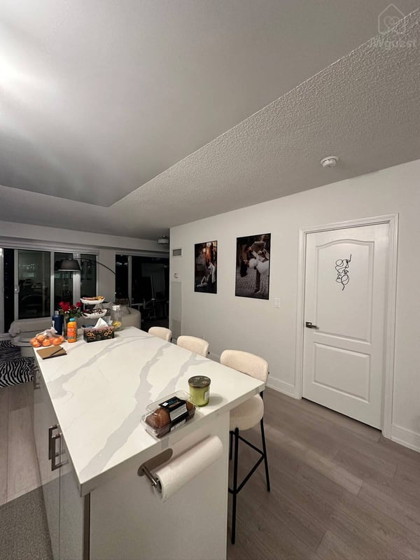 Sleek modern kitchen with generous counter space and storage — Downtown Toronto Stay | Steps from CN Tower & King West, Toronto, Ontario