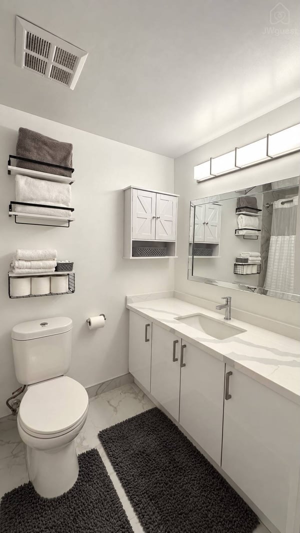 Bathroom with a wide mirror — Downtown Toronto Stay | Steps from CN Tower & King West, Toronto, Ontario