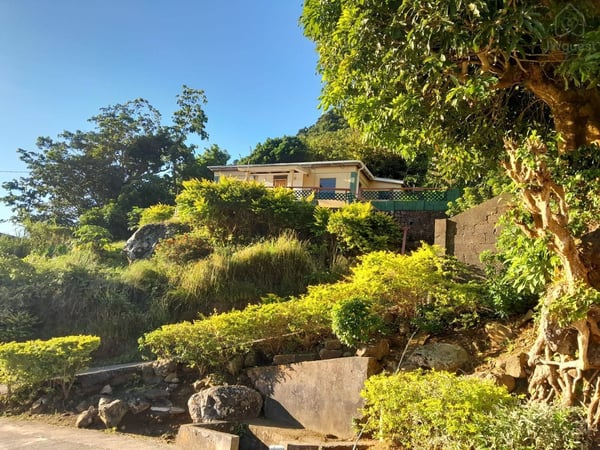 The house from the road, steps are an uphill climb up that is totally worth it! — Sunrising Breeze at Grand Bay Dominica, Saint Patrick Parish