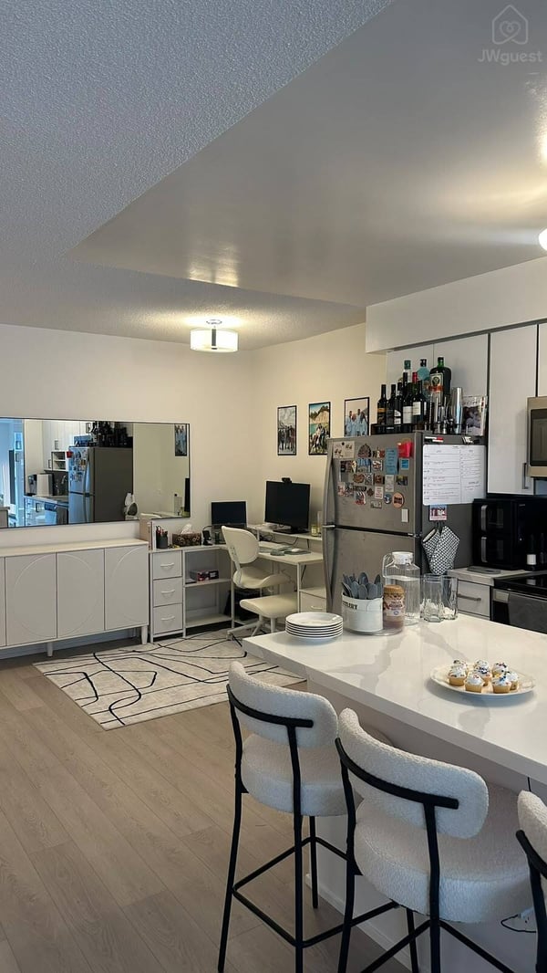 Modern kitchen island with bar seating for casual meals — Downtown Toronto Stay | Steps from CN Tower & King West, Toronto, Ontario
