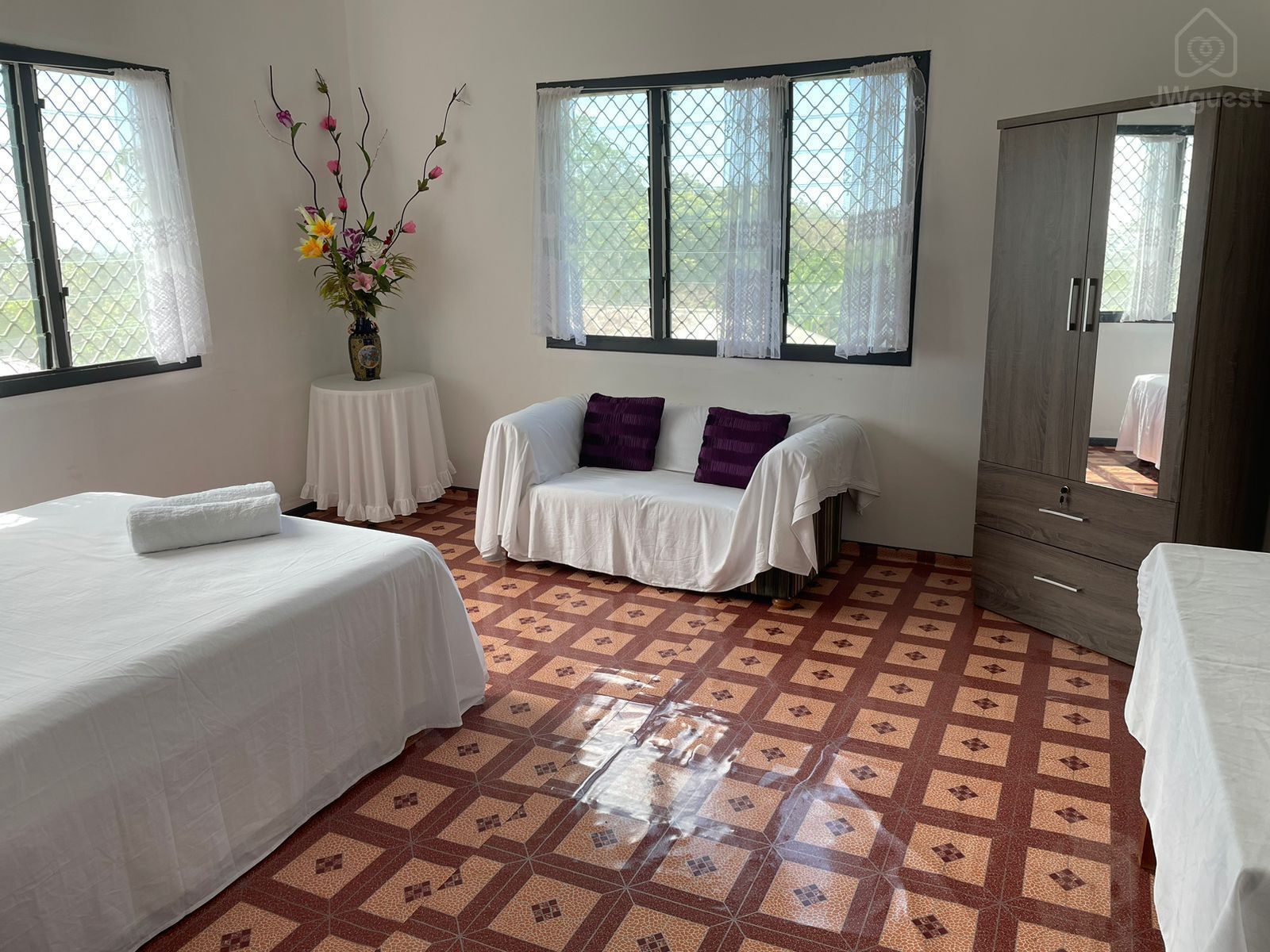 Spacious bedroom with queen bed and portable airconditioner, wardrobe and couches (single bed able to be added to room… — Shared island home in beautiful Samoa - 2, Apia, Upolu