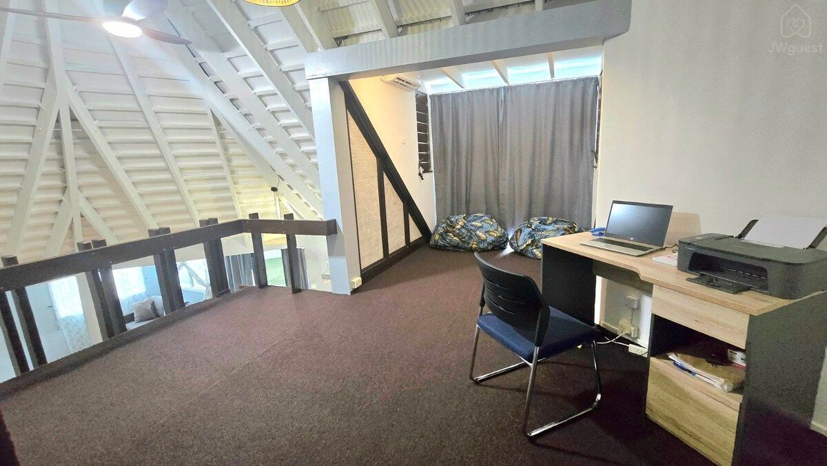 Desk and workspace in an open upstairs loft — Villa Tautai, Pacific Harbour, Central Division