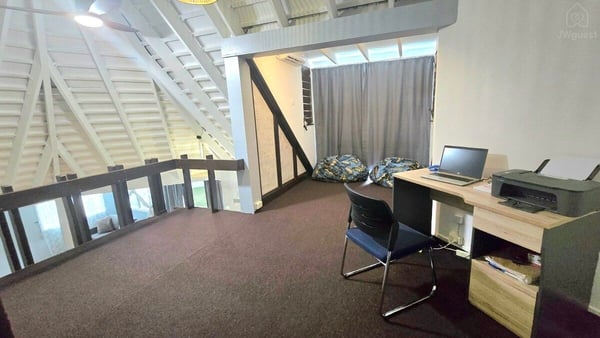 Desk and workspace in an open upstairs loft — Villa Tautai, Pacific Harbour, Central Division