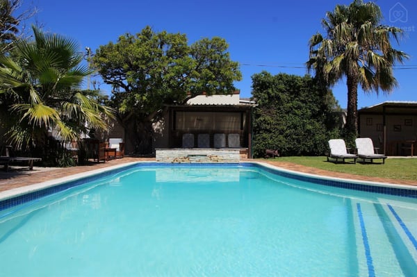 Pool, deck, and seating areas — Wonderful Studio Apartment between 2 Oceans #2, Cape Town, Western Cape