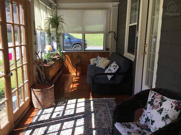 Guest sitting area on side porch and guest’s acc — Rooms on the River Free Parking Wi-Fi, South Lee, Massachusetts