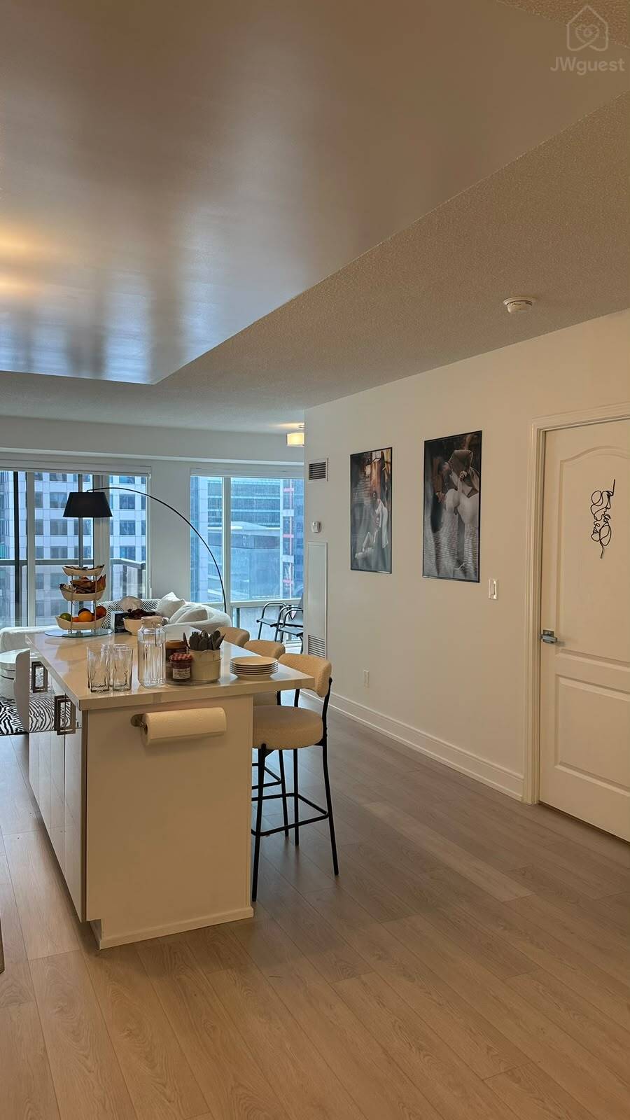 Open-concept kitchen with a large island and plenty of natural light — Downtown Toronto Stay | Steps from CN Tower & King West, Toronto, Ontario