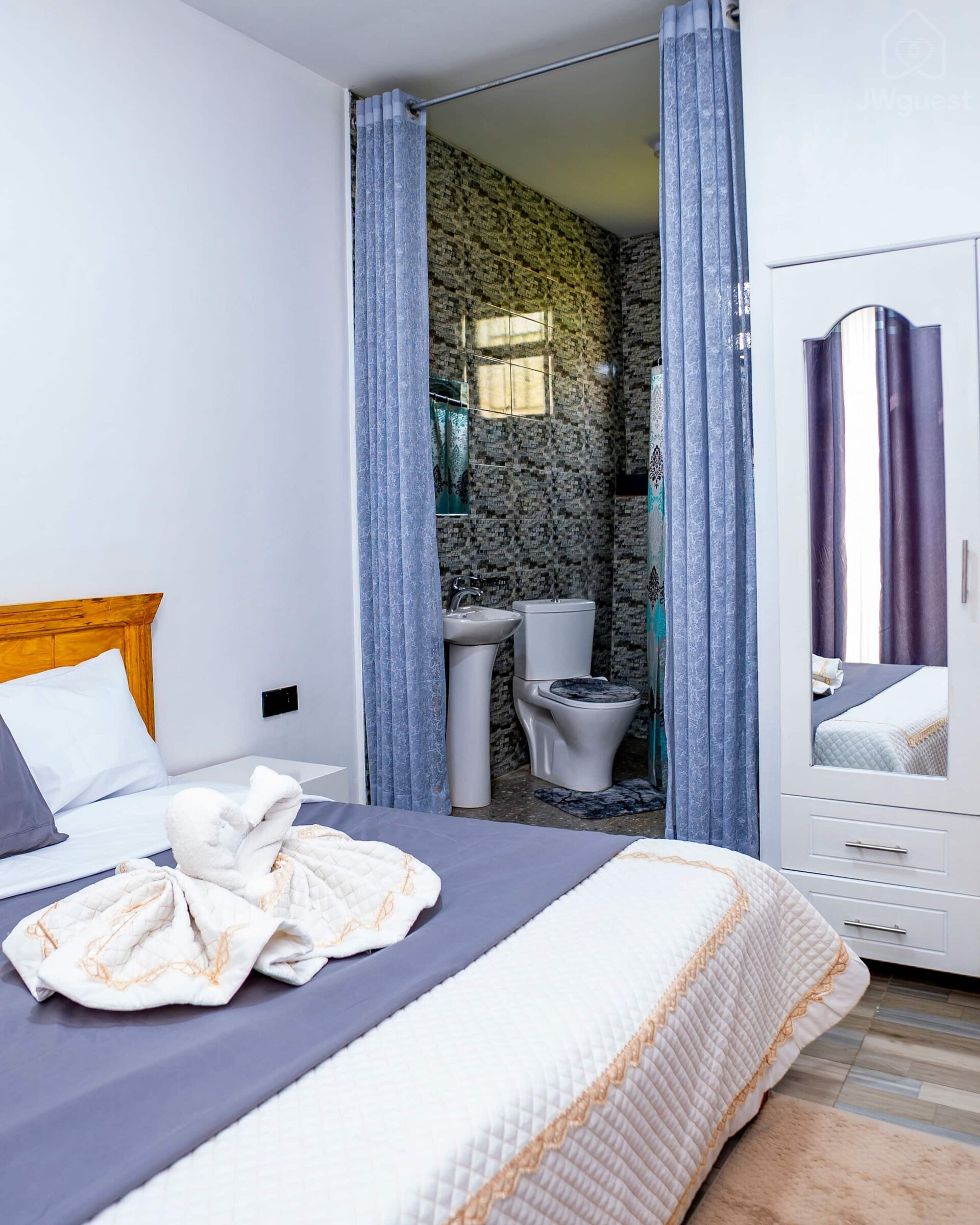 Bedroom 1 - ENSUITE With a comfortable bed, newly furnished for your comfort and cozy sleep. There are also two bed… — Cozy 2-Bedroom Haven Near KGL Airport - Valley View, Kigali, Kigali City