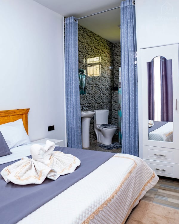 Bedroom 1 - ENSUITE With a comfortable bed, newly furnished for your comfort and cozy sleep. There are also two bed… — Cozy 2-Bedroom Haven Near KGL Airport - Valley View, Kigali, Kigali City