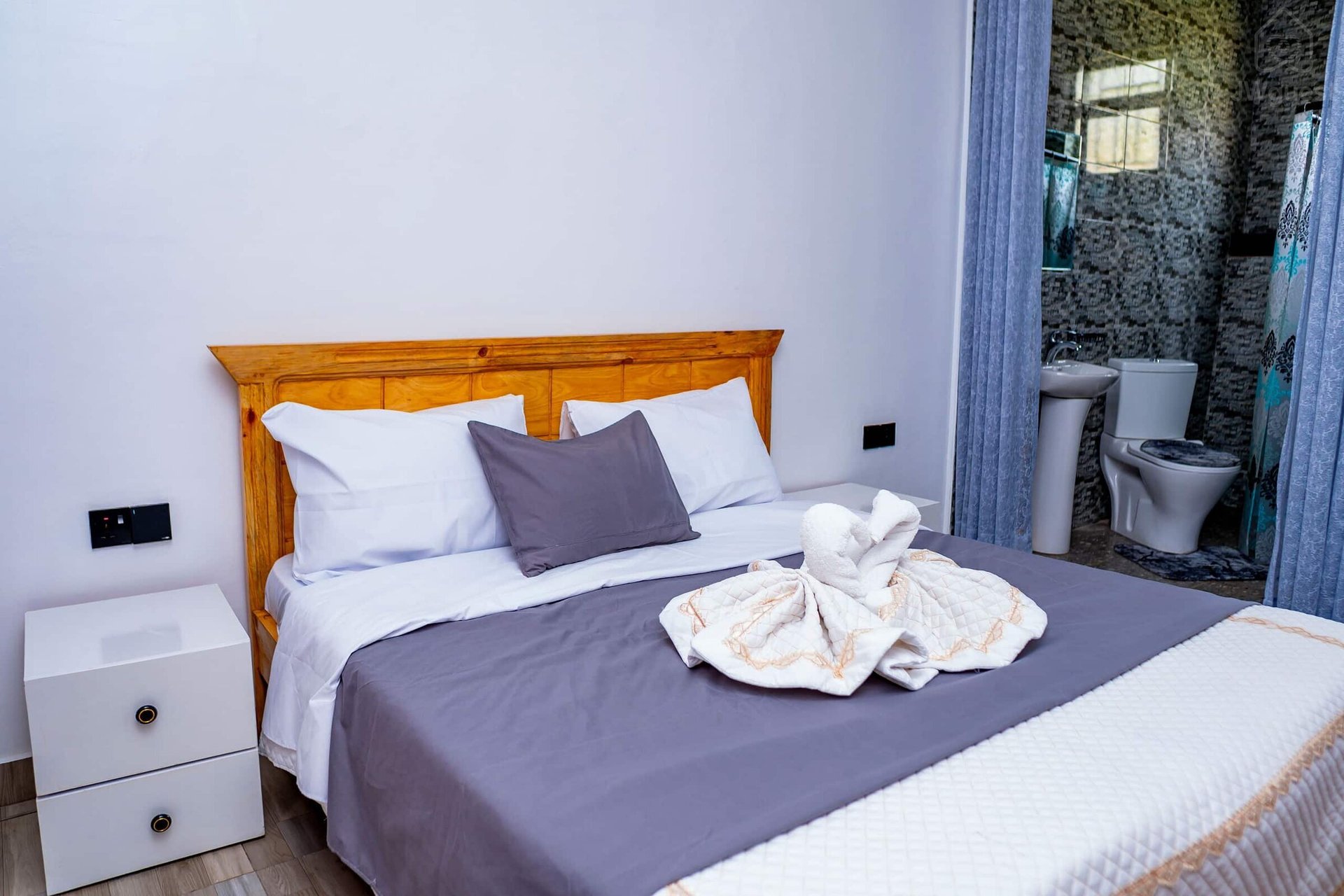 Bedroom 1 - ENSUITE With a comfortable bed, newly furnished for your comfort and cozy sleep. There are also two bed… — Cozy 2-Bedroom Haven Near KGL Airport - Valley View, Kigali, Kigali City